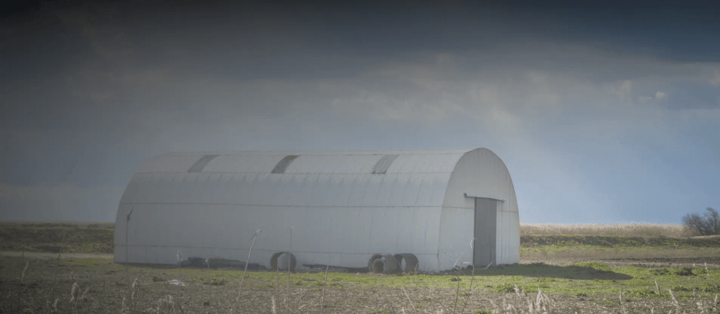 Quonset SteelMaster building on a field