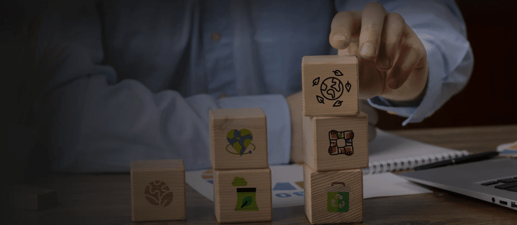 Man keeping wooden blocks showcasing sustainable facility management at work