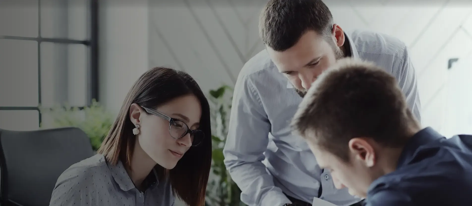 Corporate employees discussing the implication of the FM system to their facility