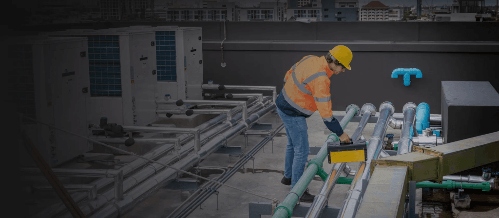 Staff member carrying a kit box arrives at the location of a maintenance requested through facility management software.