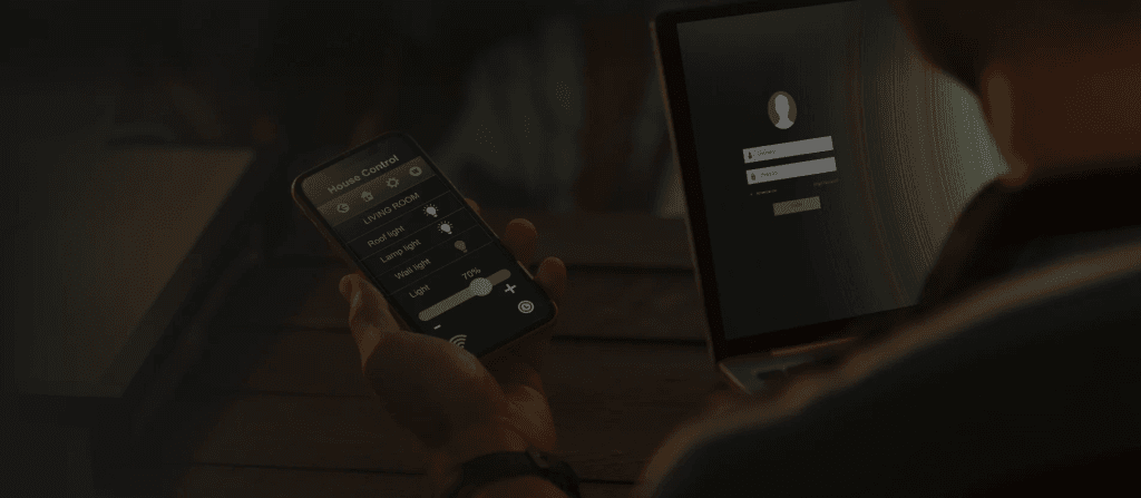 Man using mobile phone for remote asset monitoring for home.